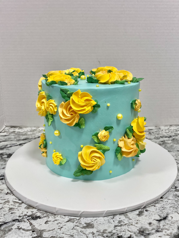 Picture of Turquoise Buttercream Cake with Yellow Rosettes