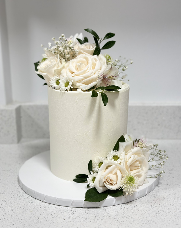 White Wedding Cake in Buttercream with White Roses