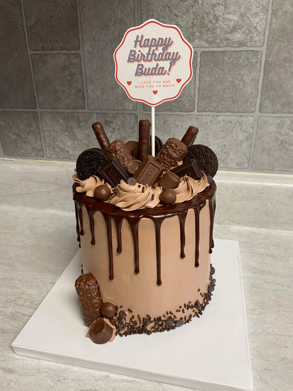 Triple Chocolate Drip Cake with oreos and twix and chocolate covered pretzels
