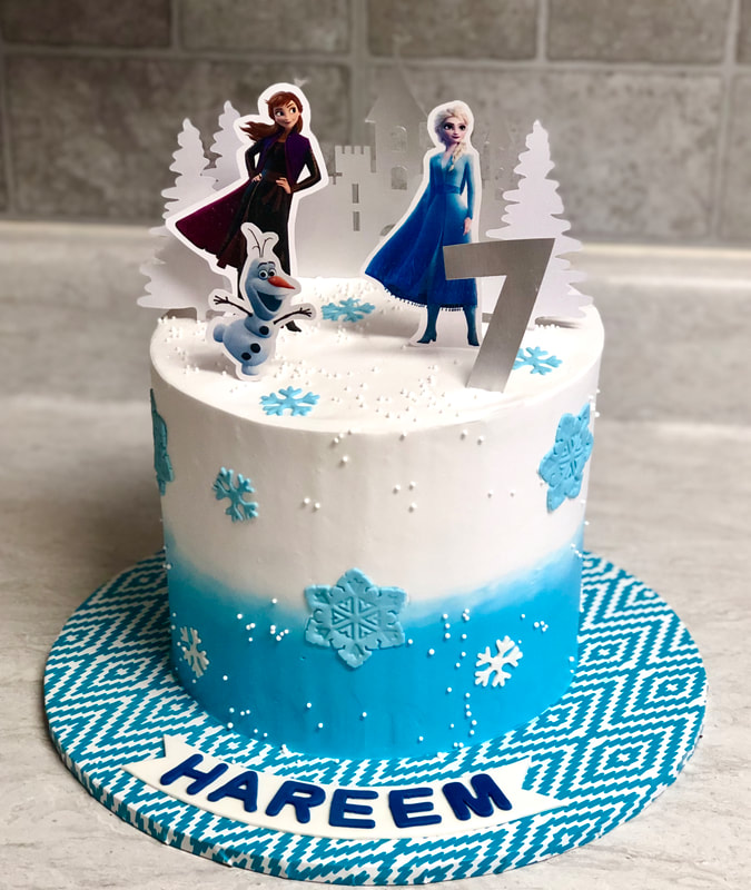 Blue and White FROZEN Cake with snowflakes, Anna and Elsa, and Olaf with the Castle