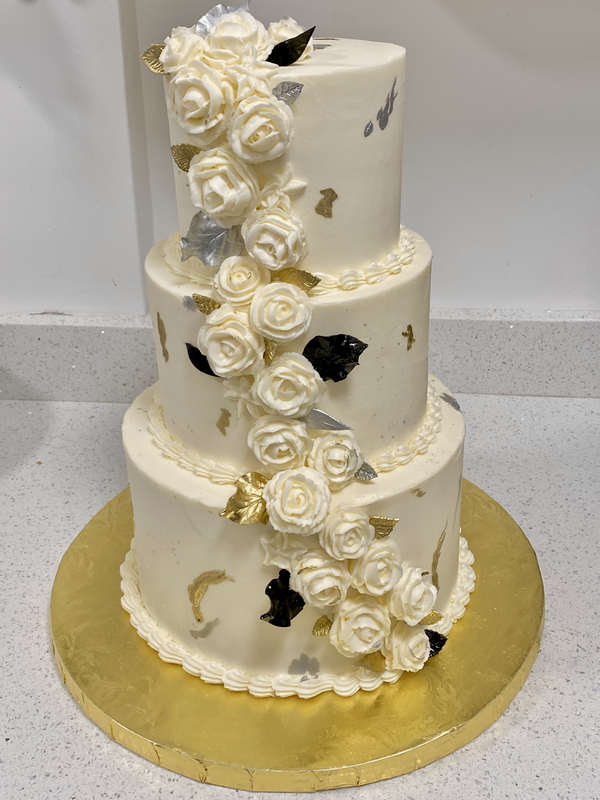 Picture of 3-tier Cake with White Buttercream flowers, gold & silver detail